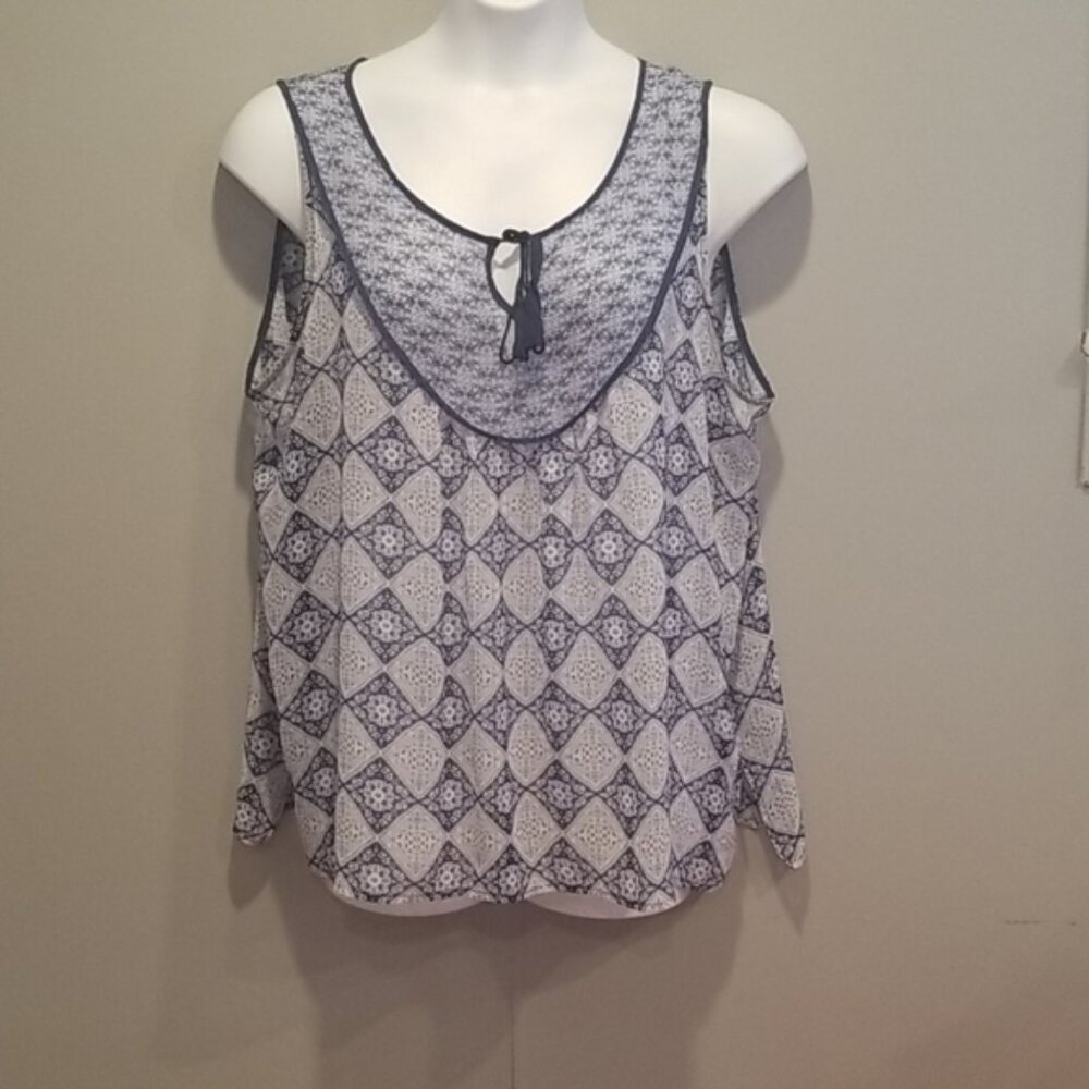 Rose & Olivia blue design sheer sleeveless blouse.